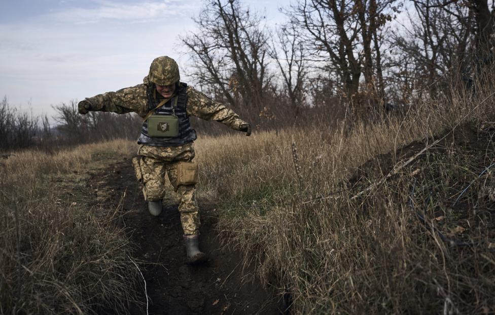 AP Photo/ Libkos