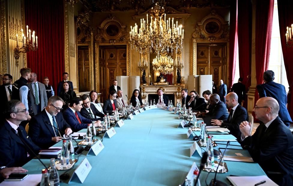 JULIEN DE ROSA/ Pool via REUTERS