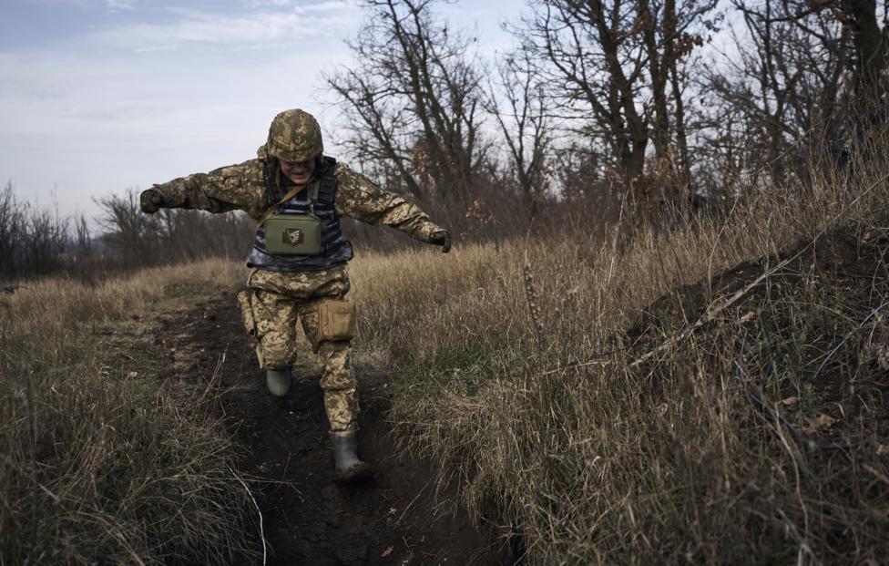 AP Photo/ Libkos