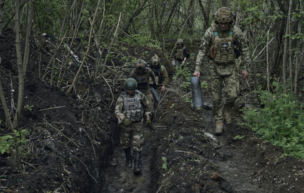 AP Photo/ Libkos
